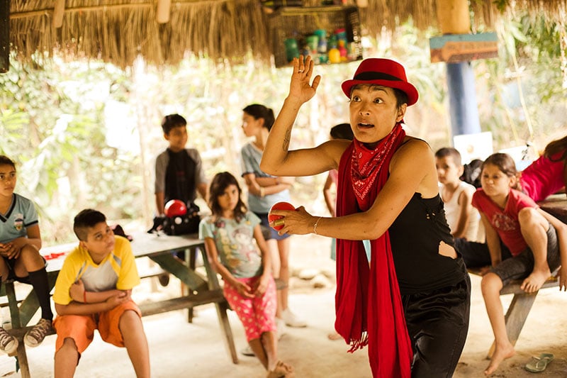 Volunteer dances and plays with children in the Childcare Project in Mexico