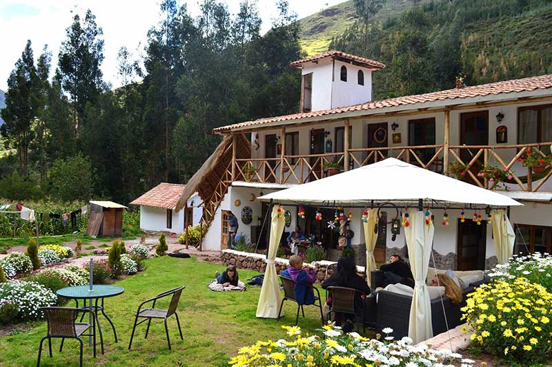 House with garden in front of mountain in Cusco Peru